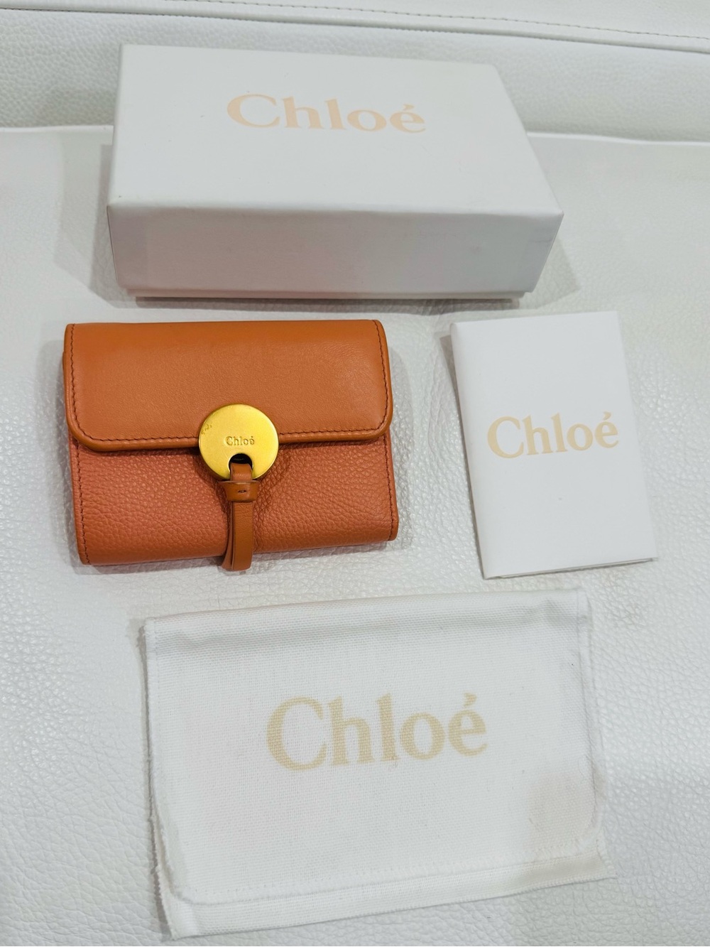 Chloé Orange Pebbled Leather Compact Wallet with Gold Disc with box + dust bag